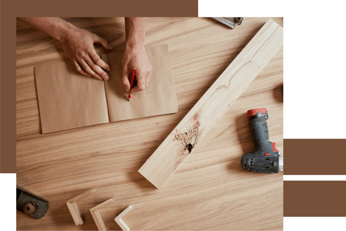 Person performing woodwork on the floor