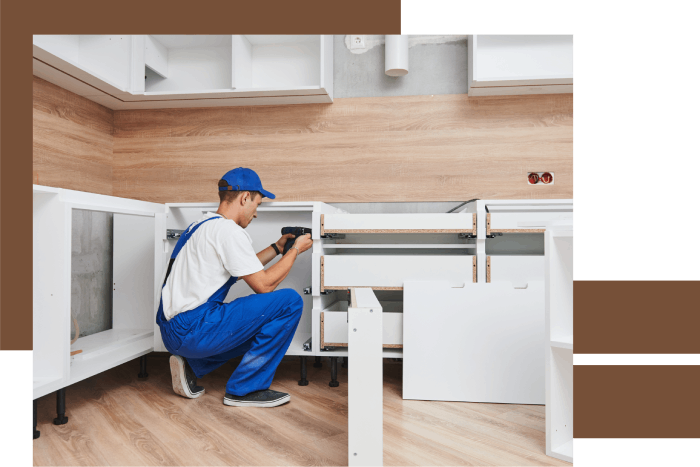 Technician performing woodwork in kitchen