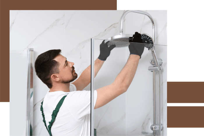 Technician working in bathroom on shower