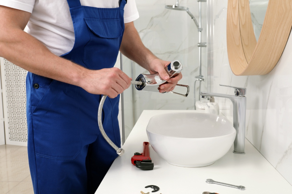 Technician working in bathroom